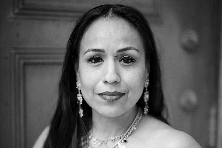 gina garcia looking at camera with stoic expression