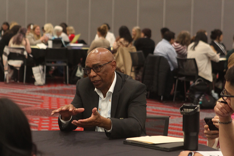 professor jabari mahiri at roundtable discussion answering questions