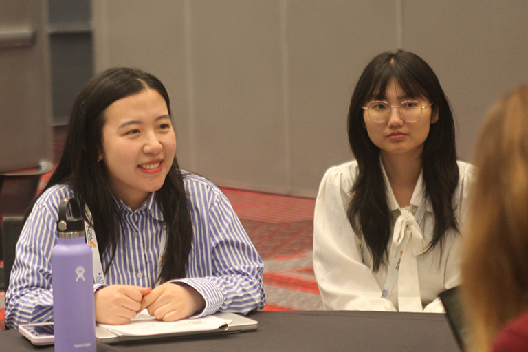 doctoral student Weiying Li at roundtable discussion talking about research findings