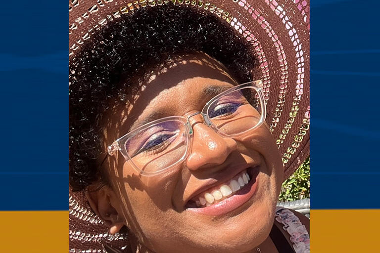 candace walker wearing sun hat smiling at camera