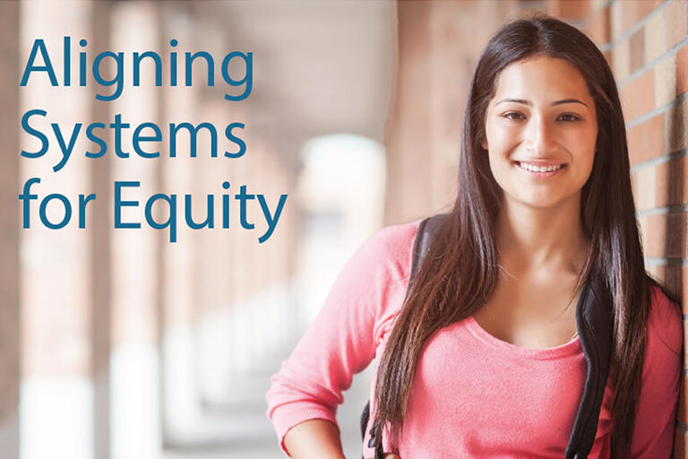 report cover with high school student leaning on brick wall smiling at camera text reads Aligning College and Career Pathway Systems for Equity
