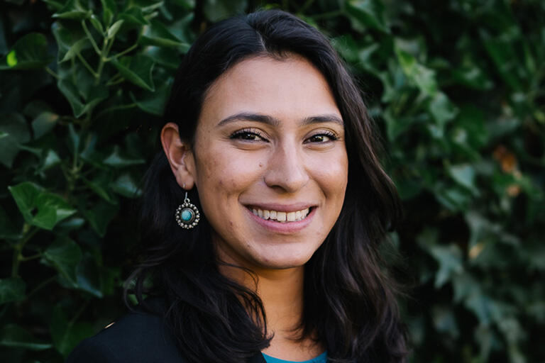 doctoral student cristina mendez smiling at camera