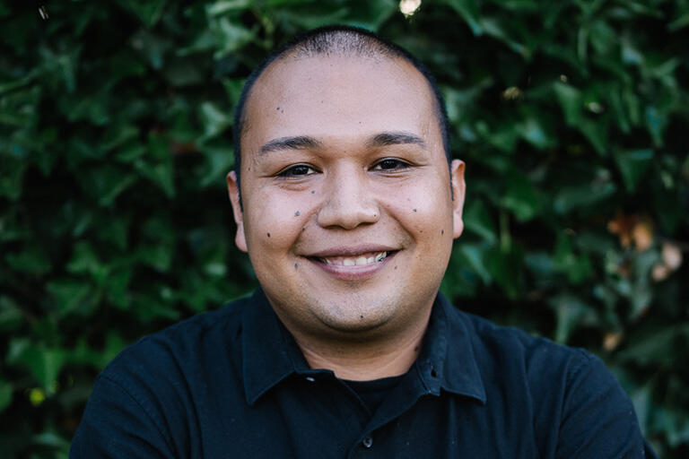 doctoral student kevin quintero smiling at camera