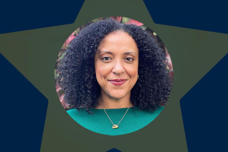 Professor janelle scott smiling at camera with star shape as background frame
