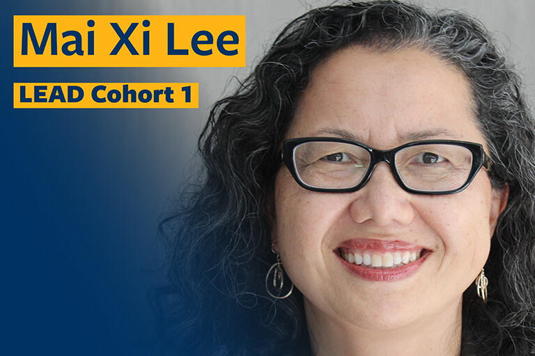mai she lee smiling at camera with text in the top left reading mai she lee lead cohort one