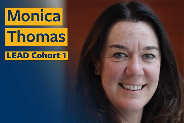 Monica thomas smiling at camera with text in the top left reading monica thomas lead cohort one
