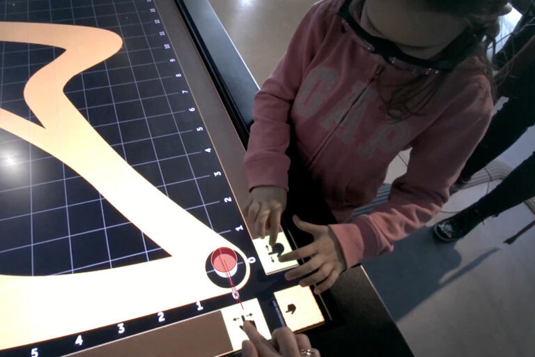child with hands on ortho activity at interactive museum in warsaw poland 