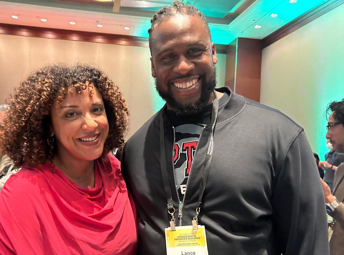 professor janelle scott and visiting scholar lance mccready smiling at camera