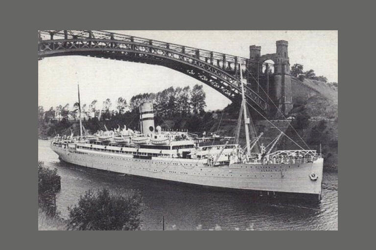 black and white photo of RMS Serpapinto on a river