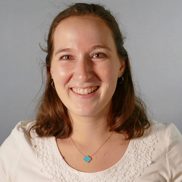 doctoral student jennie greenstein smiling at camera