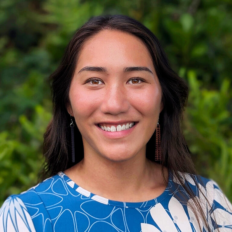 acting assistant professor kourtney kawano smiling at camera