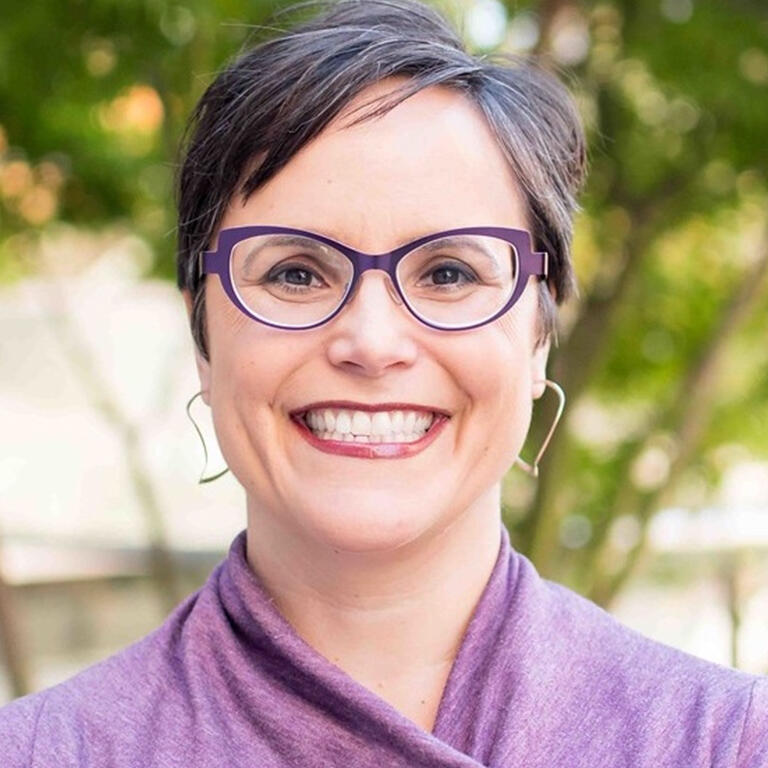 professor lisa garcia bedolla smiling at camera wearing lavender top