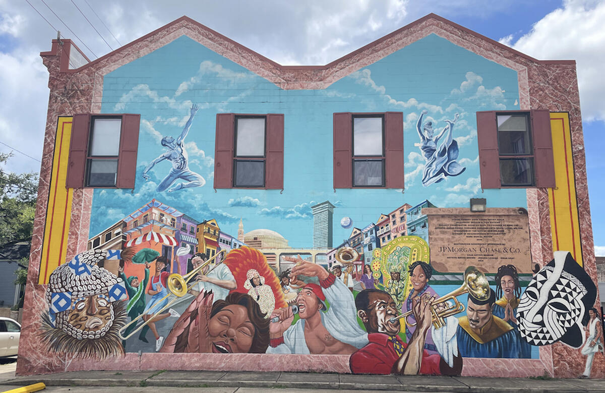 mural in New Orleans showing musicians dancers church choir members and other folx from the community