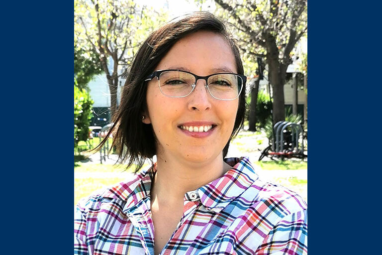 doctoral student maria rojas smiling at camera