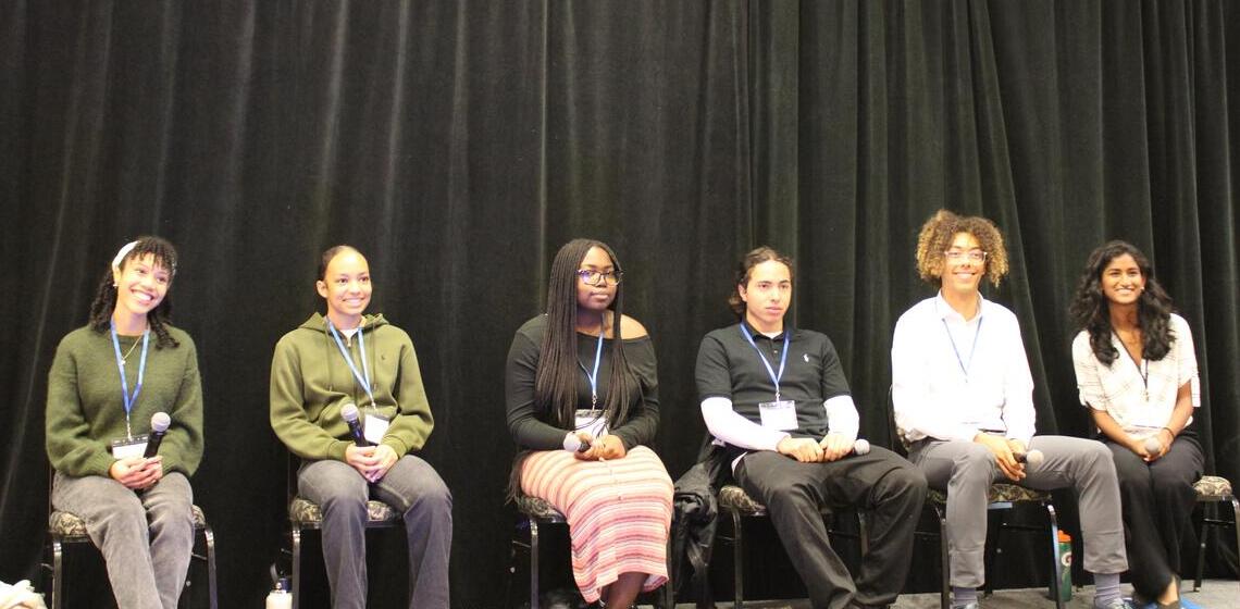 student panelists on stage during bara summit