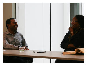 Professor Thomas M. Philip and MFEI Executive Director Alicia Dixon discuss the challenges of equity and inclusion in public schools. On the table is Dr. Marcus A. Foster’s thesis, which is on loan from the University of Pennsylvania.